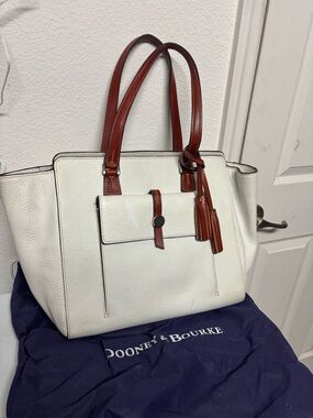 Dooney & Bourke White Pebbled Leather Tote with Brown Trim and Tassel